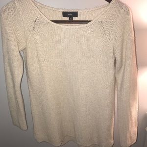 Cream colored sweater.